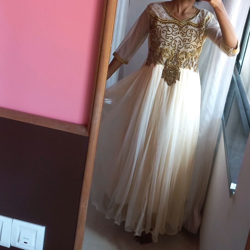 Elegant cream Anarkali set, with beautiful sequence embroidery and border