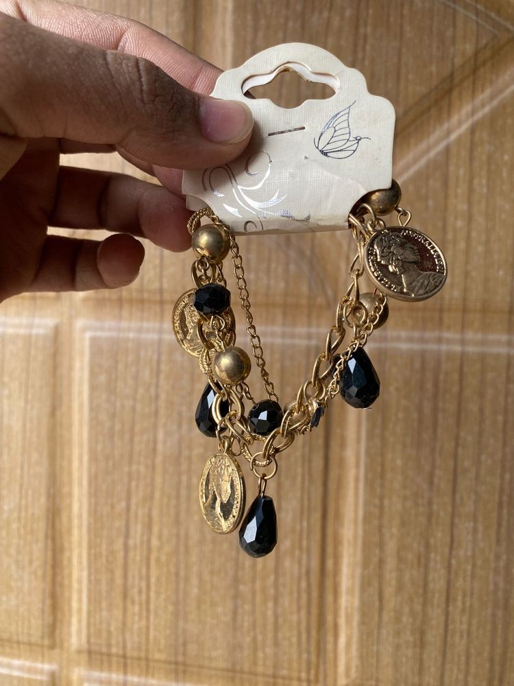 Gold Tone Coin and Bead Charm Bracelet