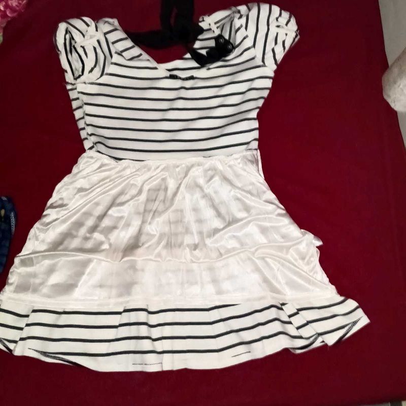 White Dress With a Bow in Back.
