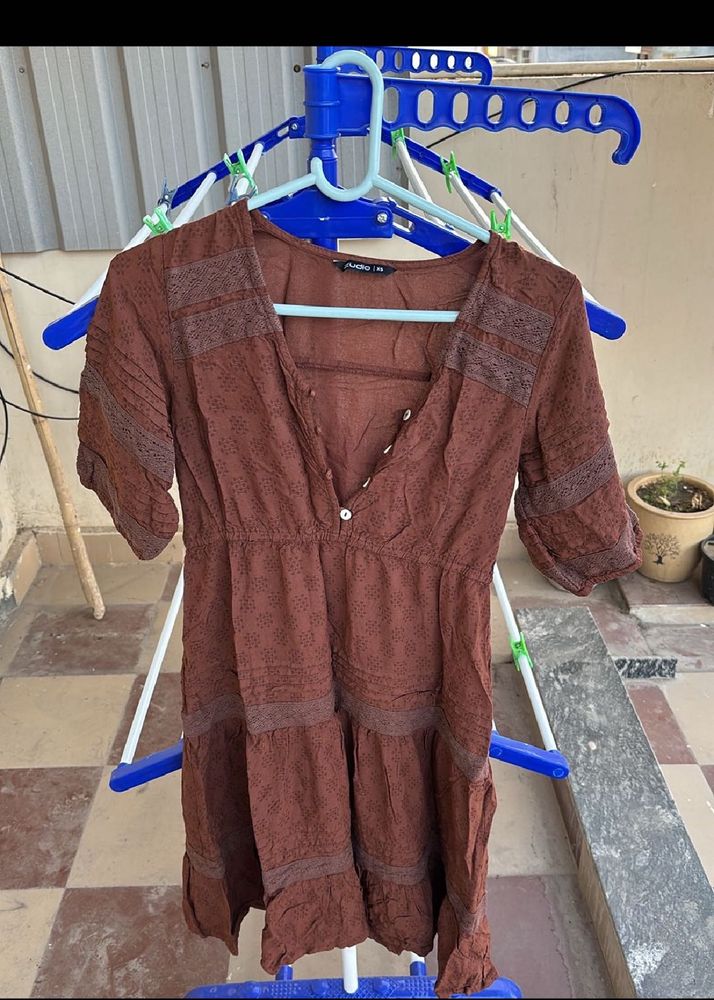 Combo of brown dress and black wide leg jeans