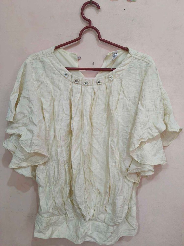 Ruffled Top with Neckline Embellishment