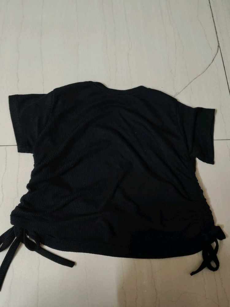it's a classic Balck crop top with side straps